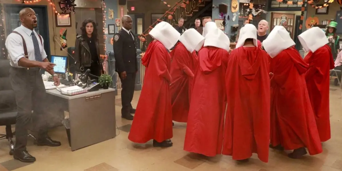 People dressed as Handmaid's Tale characters in the 99th precinct in Brooklyn Nine Nine