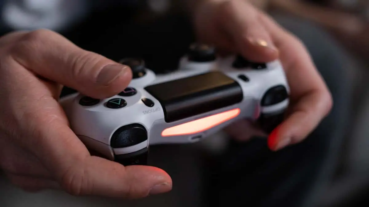 stock photo of hands on a gamepad