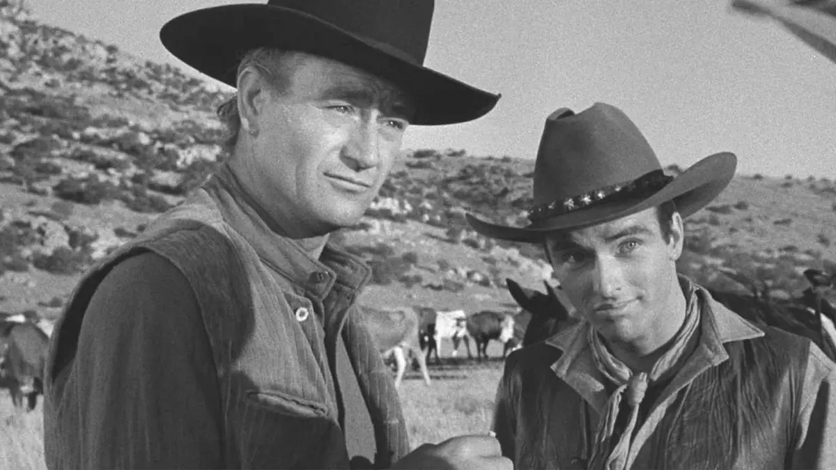 John Wayne and Montgomery Clift look on in Red River.