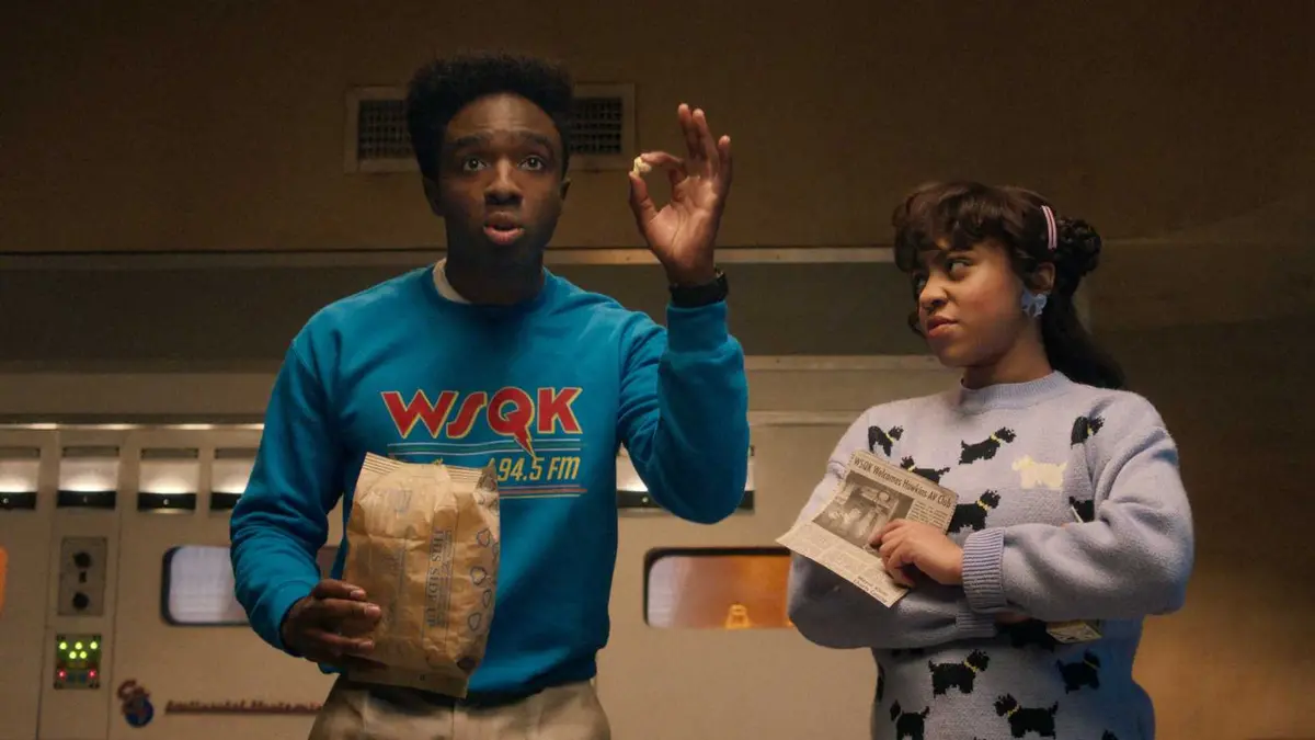 Caleb McLaughlin as Caleb with popcorn in Stranger Things