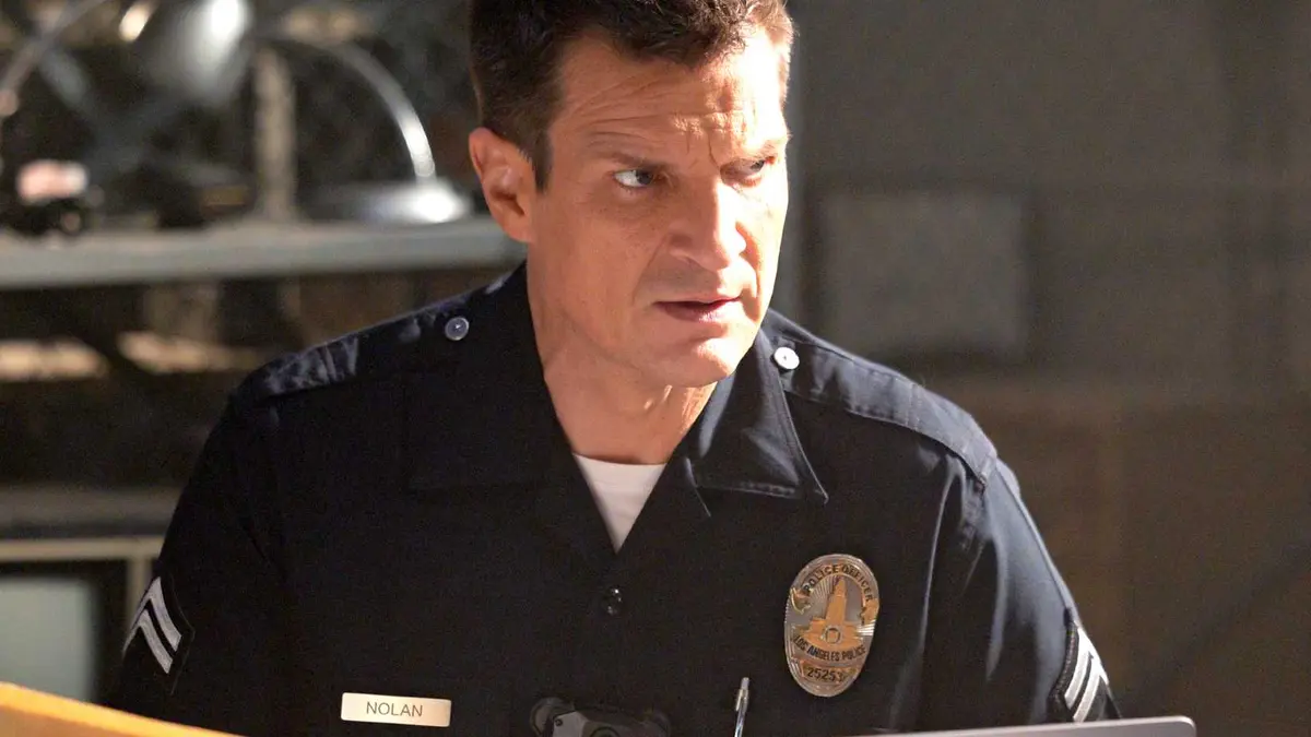 Nathan Fillion looking concerned at a desk in The Rookie