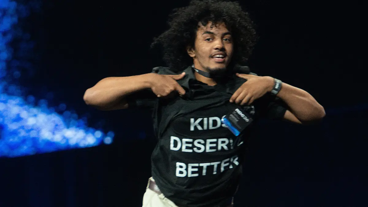 A protester rushes the stage interrupting the keynote speech of Roblox co-founder and CEO David Baszucki at the company's developers conference in San Jose, California, on September 11, 2026. (Ph