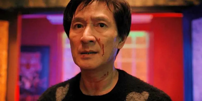Ke Huy Quan as a bloodied Marvin glaring in Love Hurts