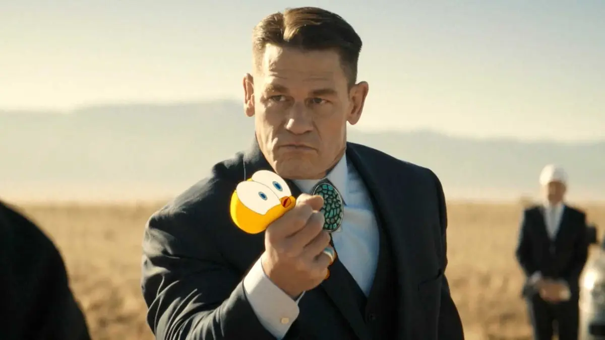Acme Corporation's lawyer Buddy Crane (John Cena) grabbing Tweety in Coyote vs. Acme