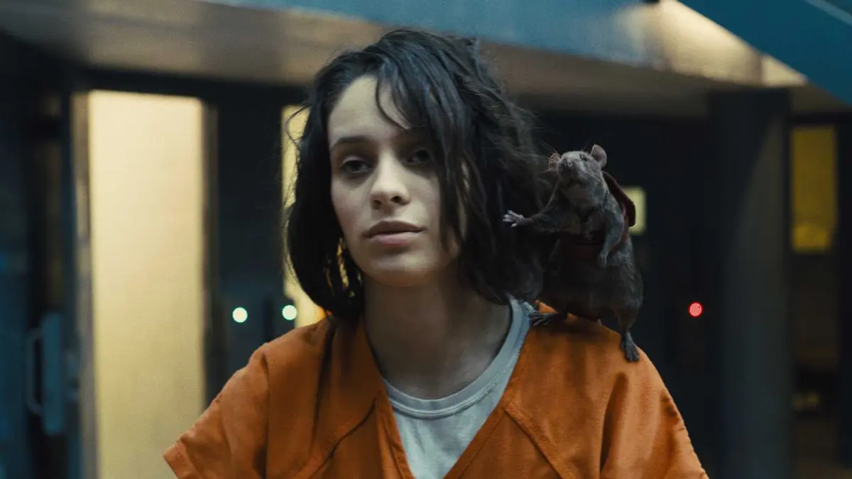 Ratcatcher 2 (Daniela Melchior) wearing an orange prison uniform with a rat perched on her shoulder in The Suicide Squad