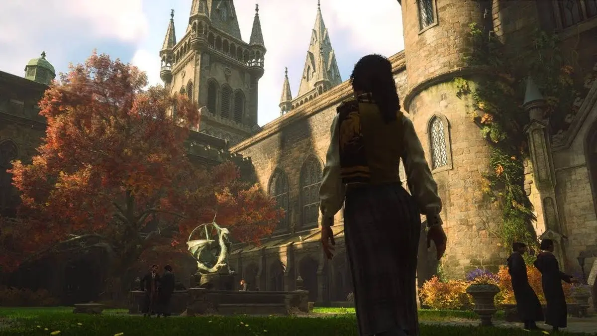 A character walking through Hogwarts during the Fall in Hogwarts Legacy.