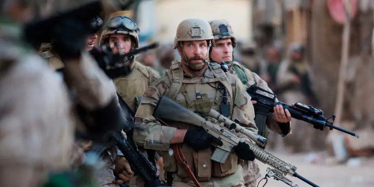Bradley Cooper as Chris Kyle leads a team of soldiers in American Sniper