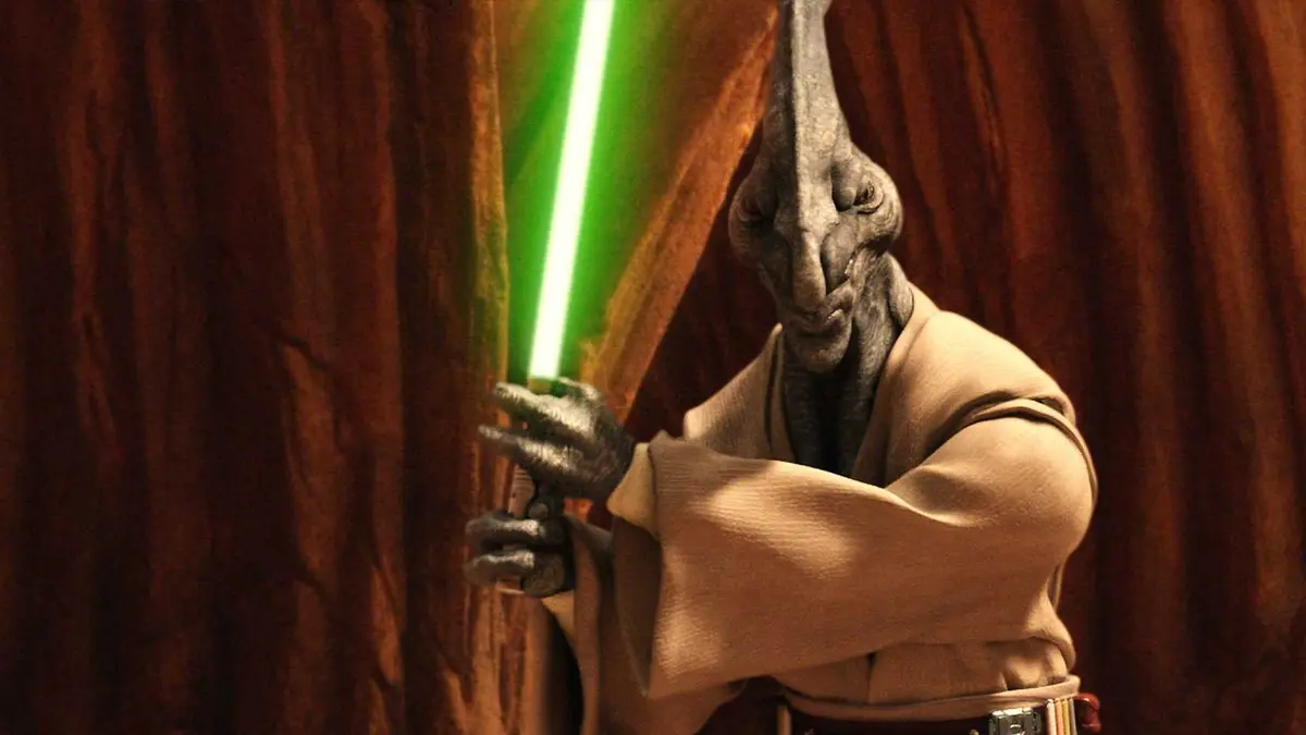 Coleman Trebor from Star Wars wields his lightsaber.