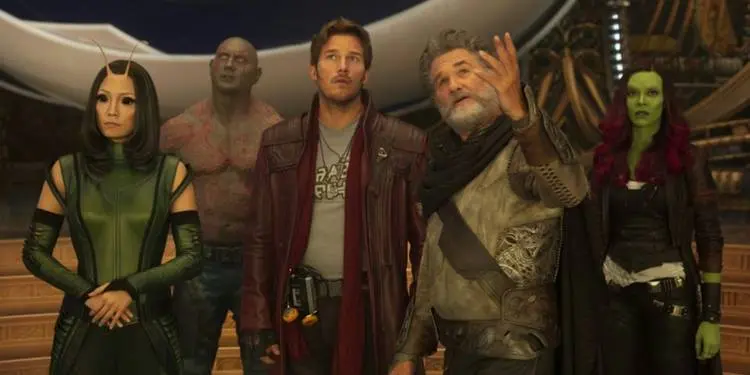 Cast of Guardians of the Galaxy Vol. 2 standing side by side looking up.