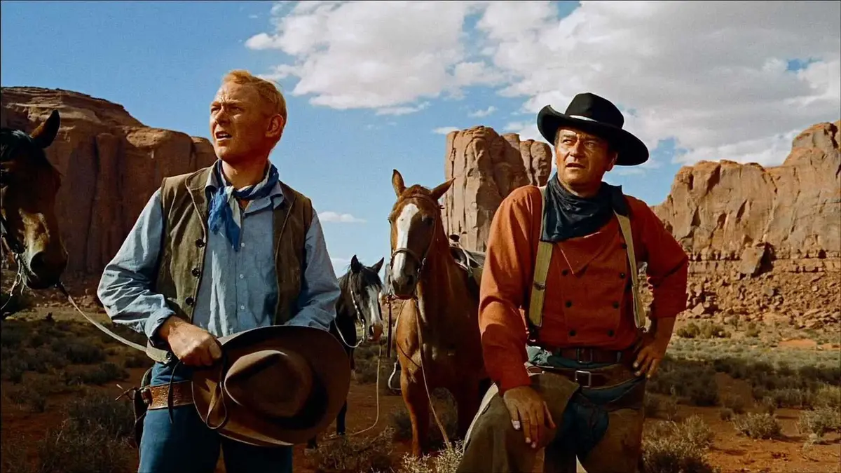 John Wayne in The Searchers standing in the desert