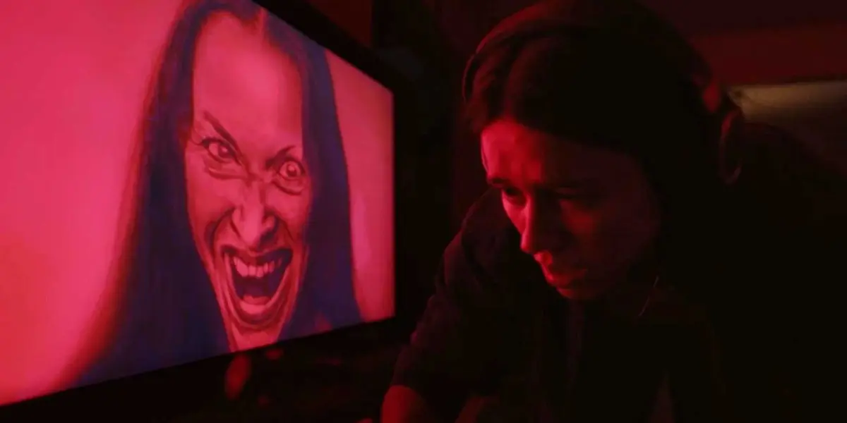 Undertone horror movie shot of a distorted face and someone looking scared