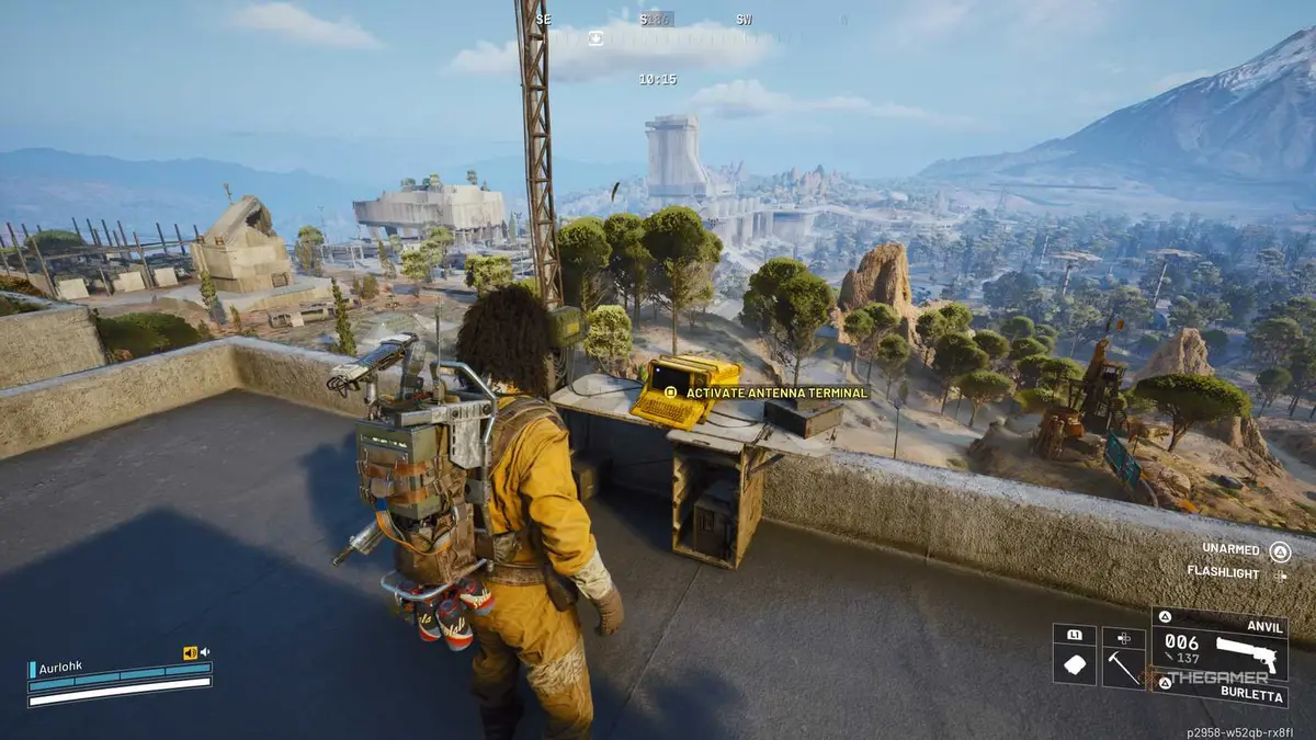 Player raider standing next to a small computer on a desk next to an antennae on the roof of the Pattern House in Arc Raiders.