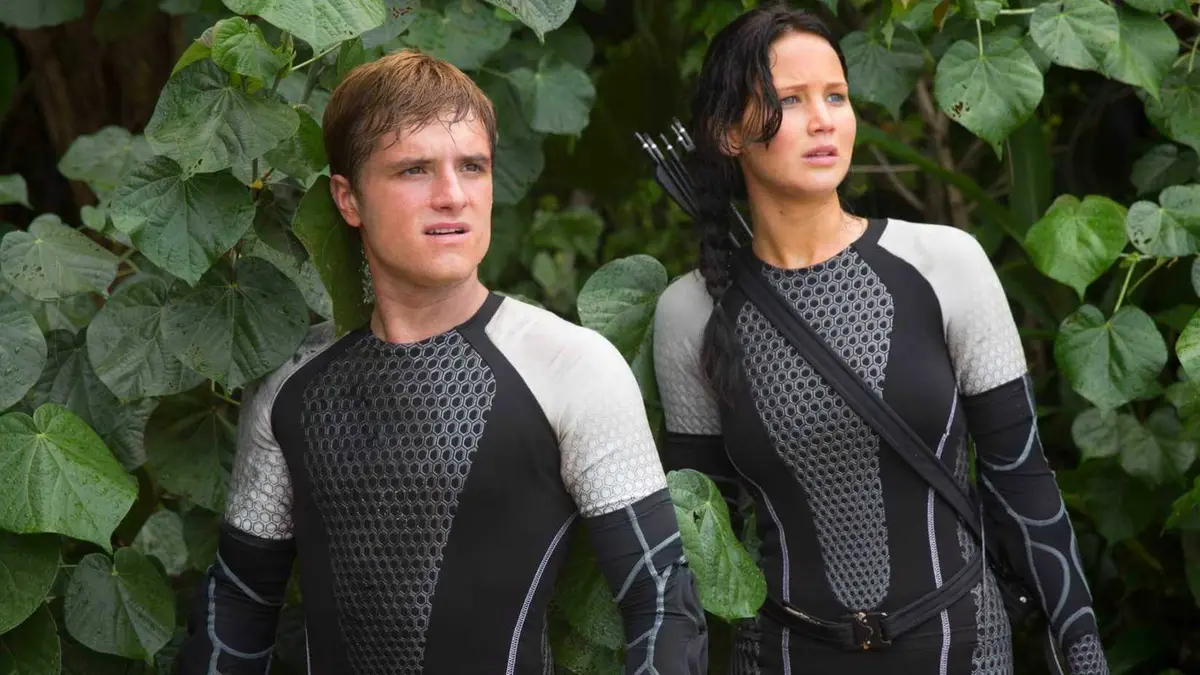 Josh Hutcherson and Jennifer Lawrence in Hunger Games Catching Fire looking off-screen