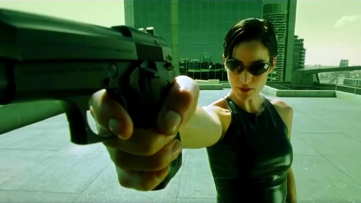 Trinity holding a gun in The Matrix.