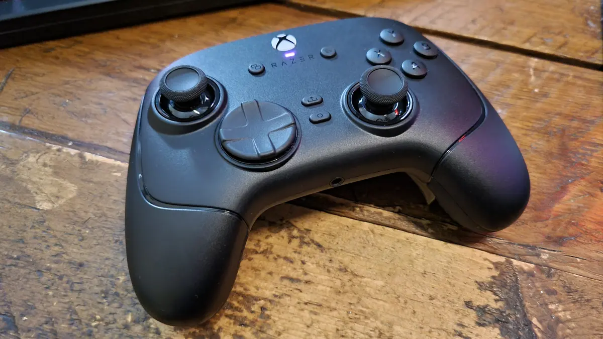 A Razer Wolverine V4 Pro gaming controller on a wooden desk