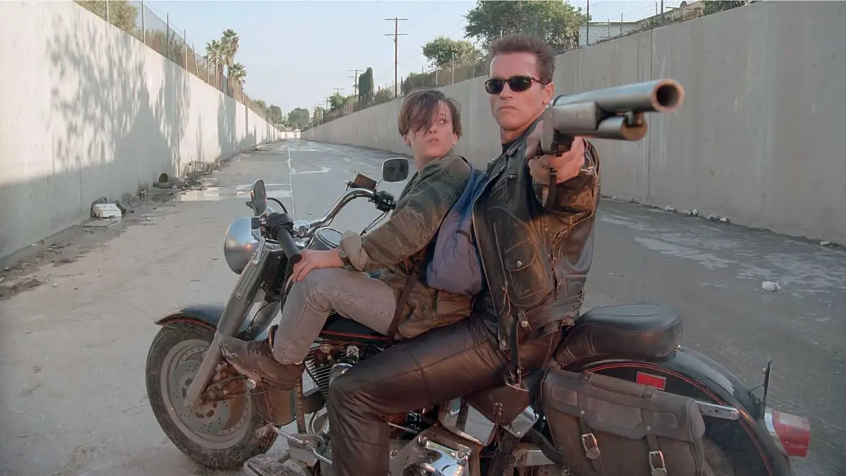 Arnold Schwarzenegger as the T-800 with Edward Furlong as John Connor in Terminator 2