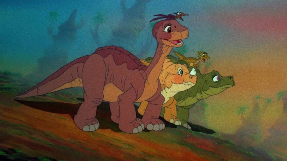 Littlefoot, Rooter, Petrie, Cera, and Ducky look on in The Land Before Time.