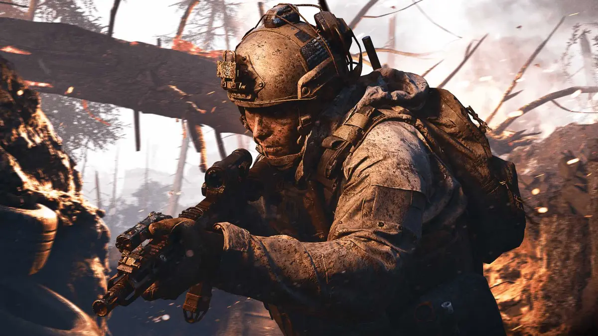 Call of Duty Modern Warfare 4 player with rifle covered in mud in forest cropped screenshot