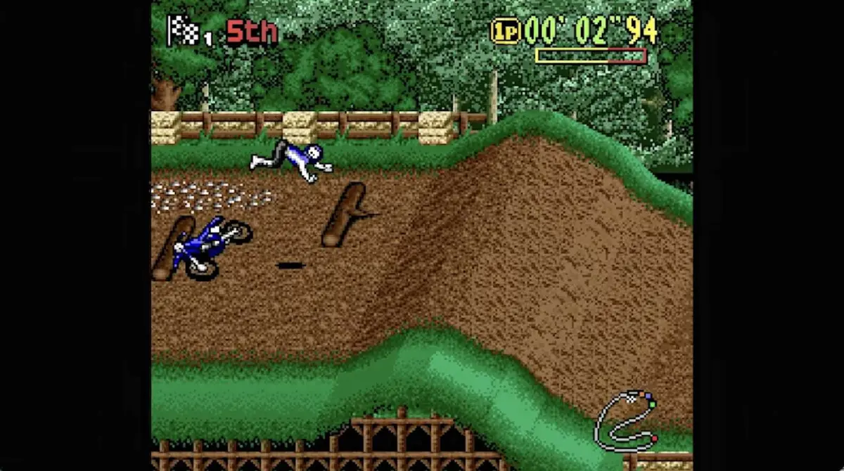 A motocross racer flies off of their bike that they've crashed on top of a hill.
