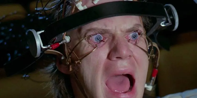 A device forces Alex's eyes open as he panics in A Clockwork Orange