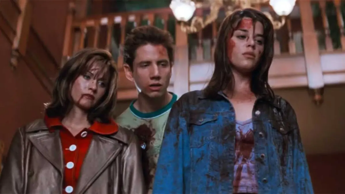 Gale, Randy, and Sidney covered in dried blood, looking annoyed in Scream (1996)