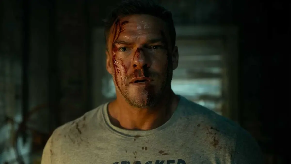 A bloodied Reacher looking concerned