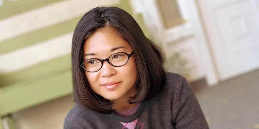 Lane Kim (Keiko Agena) smiling on Gilmore Girls.