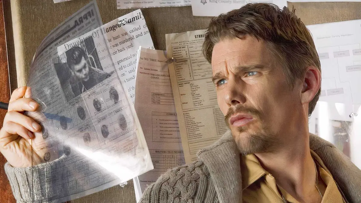 Ethan Hawke as Ellison Oswalt looking at a transparent police file while wearing a tan polo and beige cardigan in Sinister