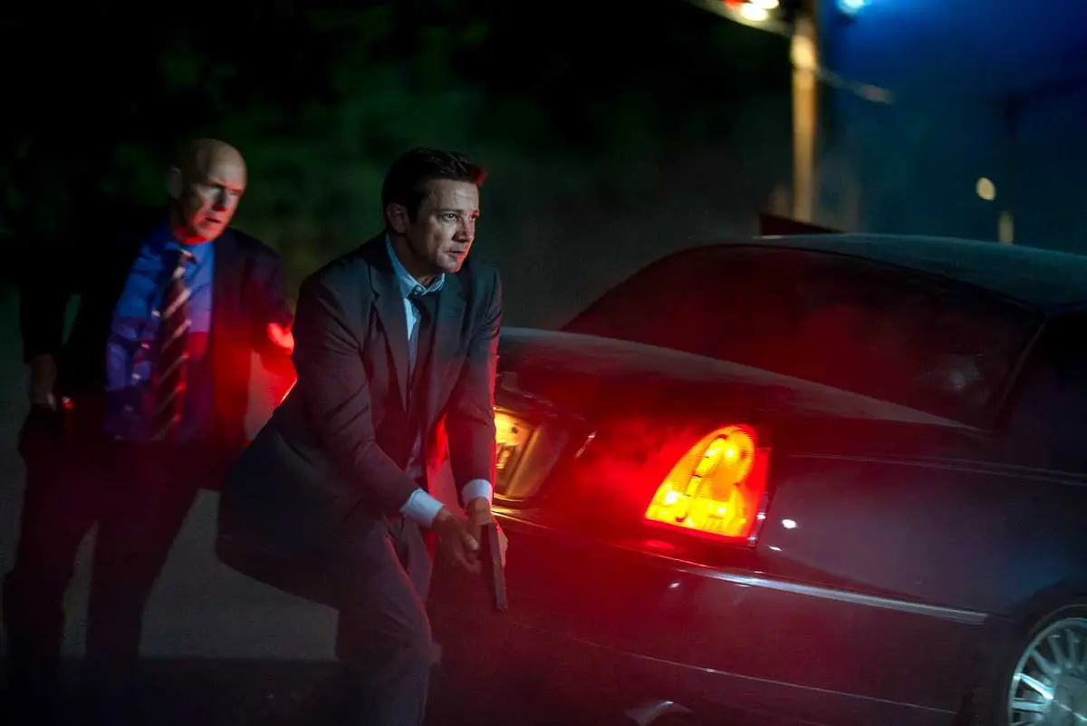 Jeremy Renner running with a gun in Mayor of Kingstown season 5