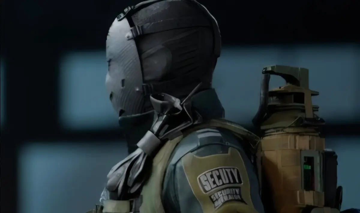 A person wearing a black tactical mask and armor with a "SECUTY" patch on the shoulder, and a large, olive-drab backpack with metallic components.