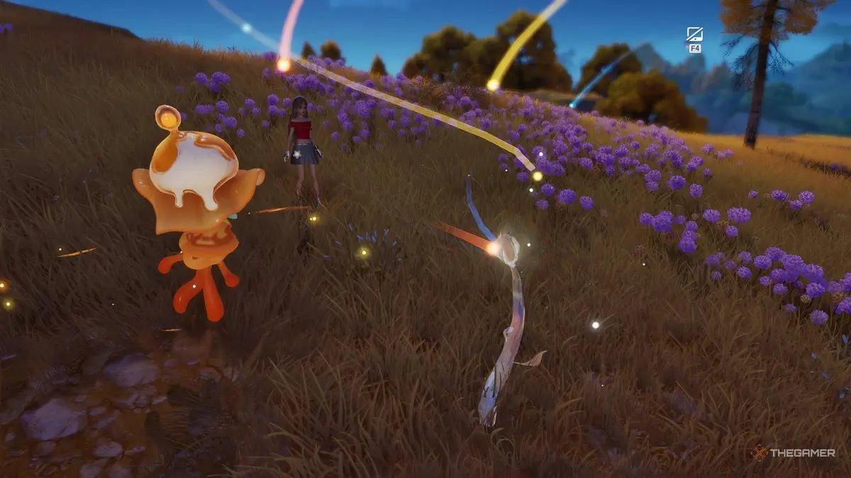 An Aniimo player and their Aniimo are standing next to a Bloom.