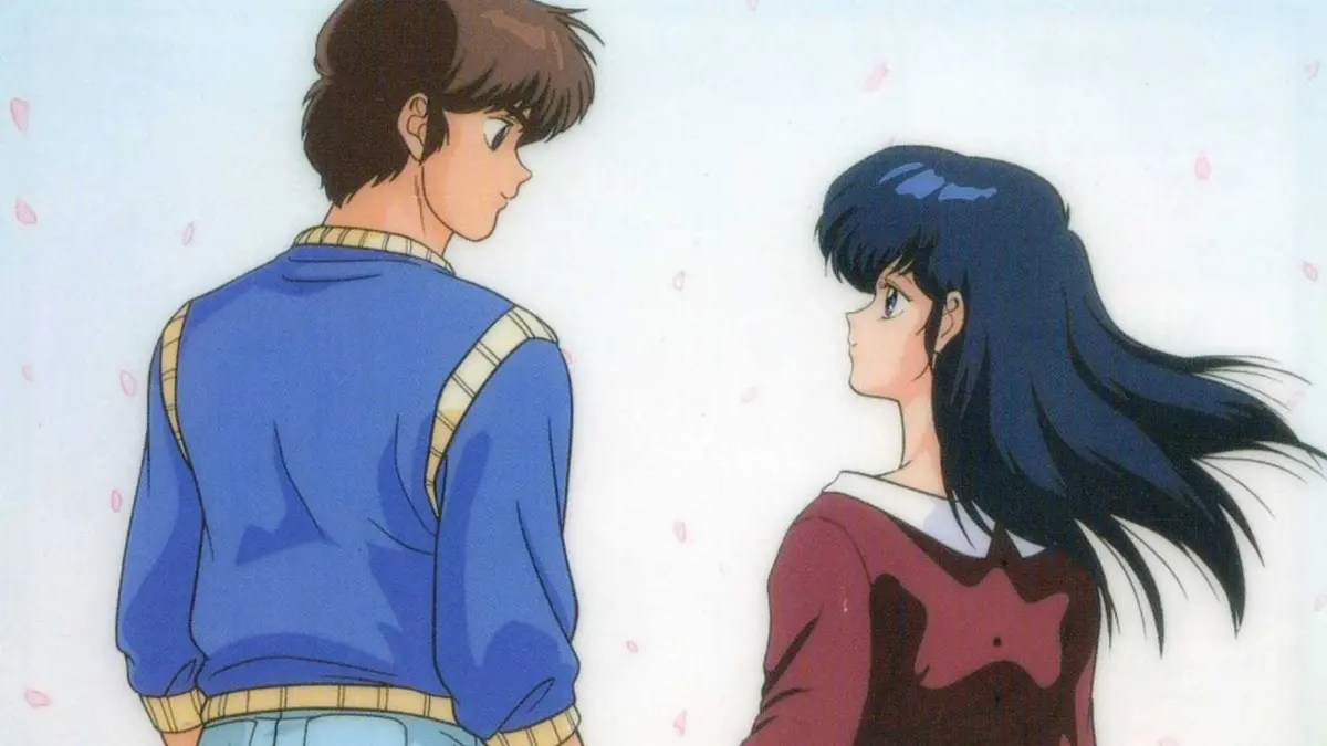 Godai Yusaku looks down at Kyoko Otonashi, who looks back lovingly at him in Maison Ikkoku.