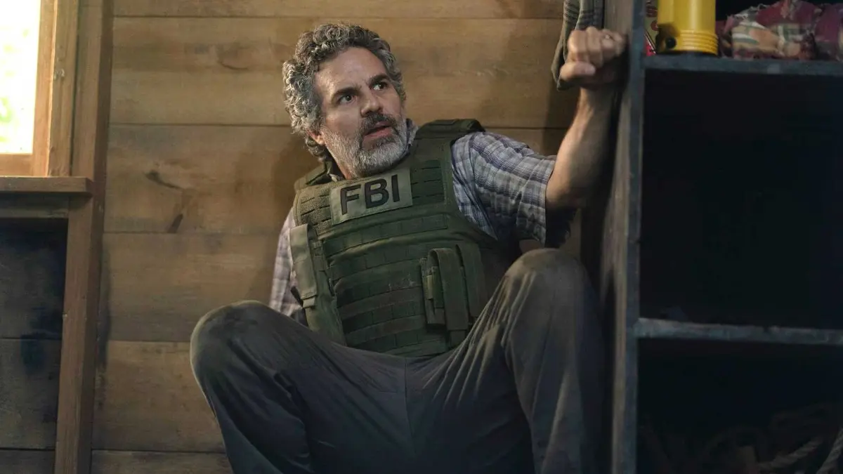 Mark Ruffalo takes cover behind a cabinet in a scene from Task season 1