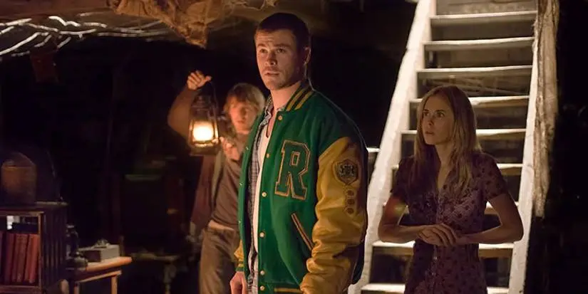 The cast of Cabin in the Woods standing in the basement.