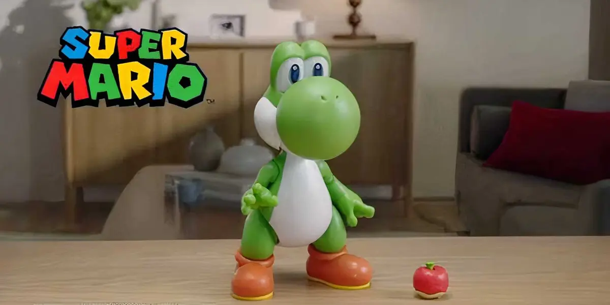 A Yoshi toy with fruit next to it