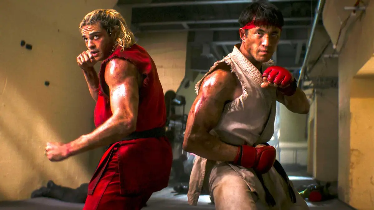 Noah Centineo's Ken and Andrew Koji's Ryu facing a hallway in fighting poses in Street Fighter