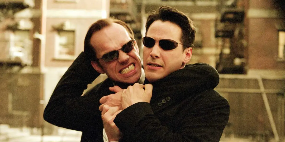 Agent Smith and Neo grappling in The Matrix.