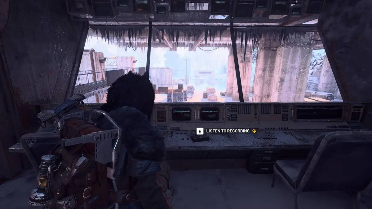 The player standing in front of the nomad recording in the Loading Bays for the Divided quest in Arc Raiders.