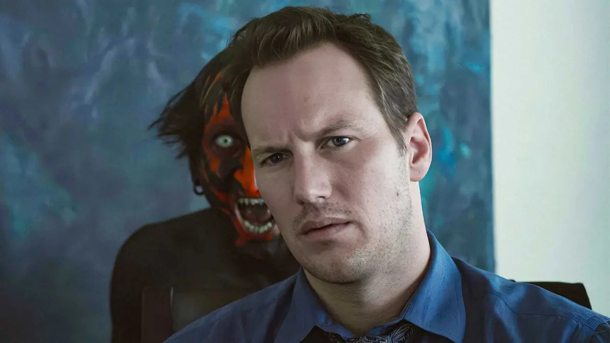 Lipstick demon hovering behind Josh in Insidious.