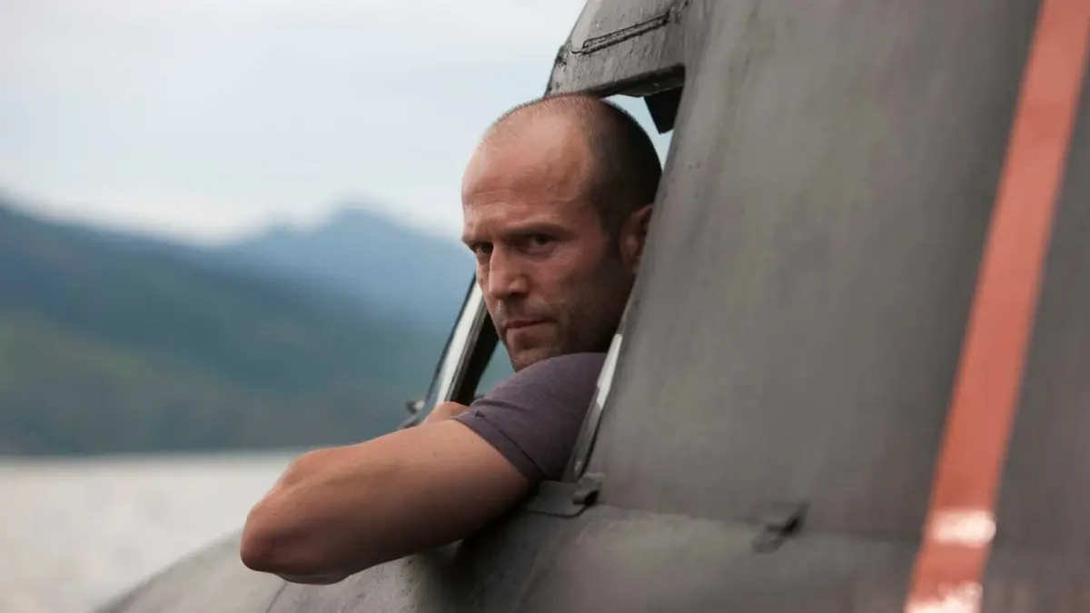 Jason Statham driving a truck in The Expendables