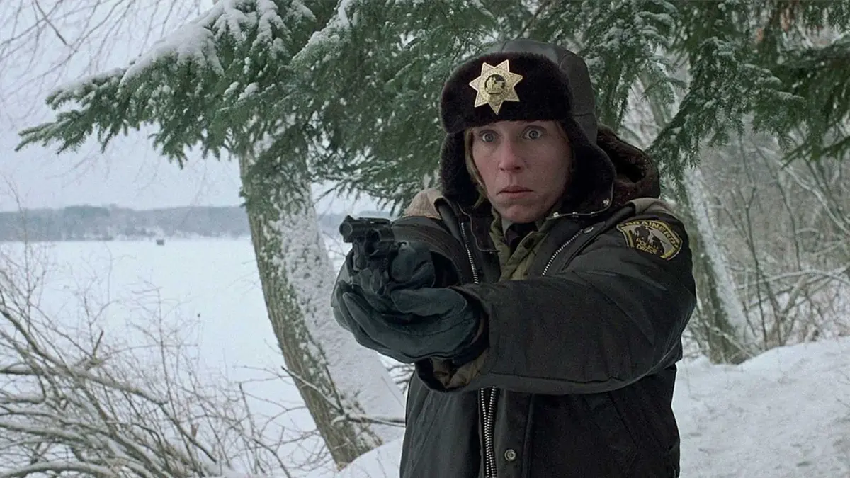 Marge points her pistol while looking shocked in Fargo