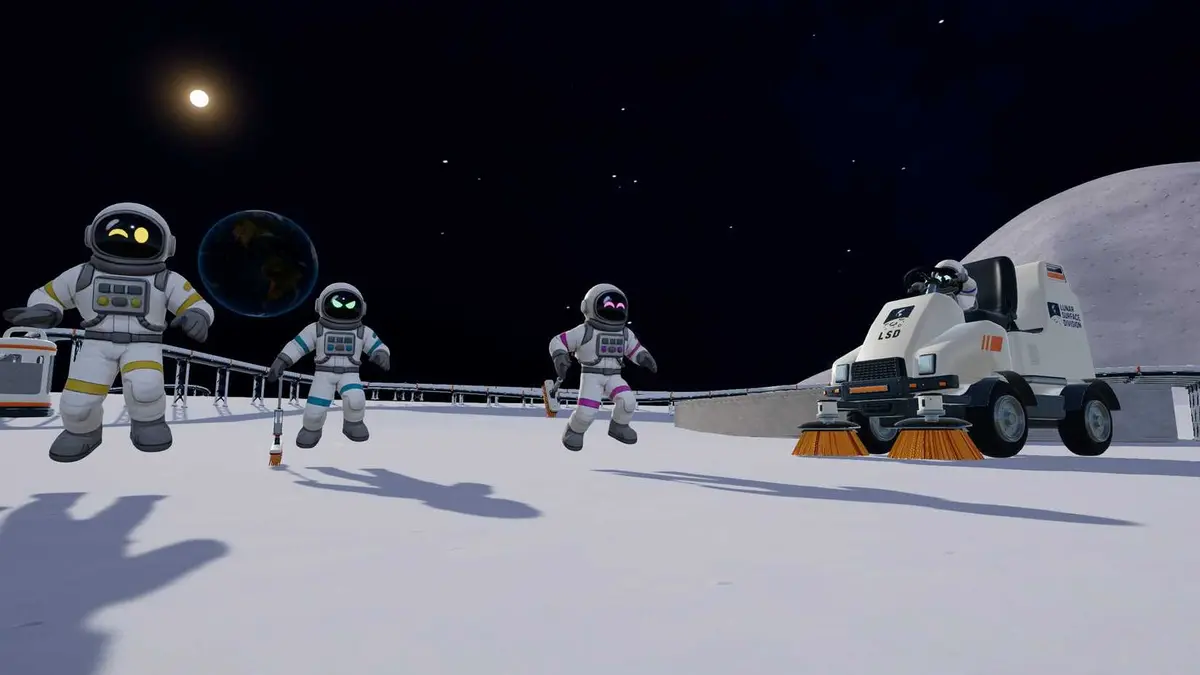 moon sweepers players next to a sweeping machine.