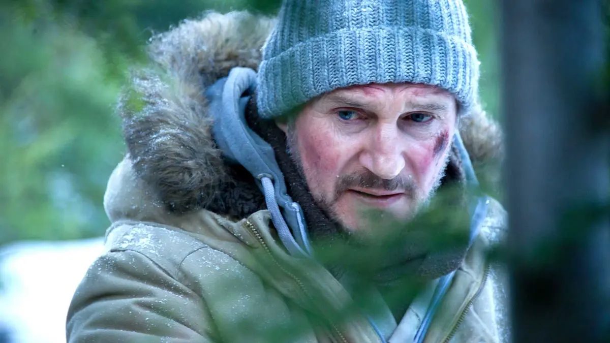 Liam Neeson's John Ottway looking tired in a snowy forrest in The Grey