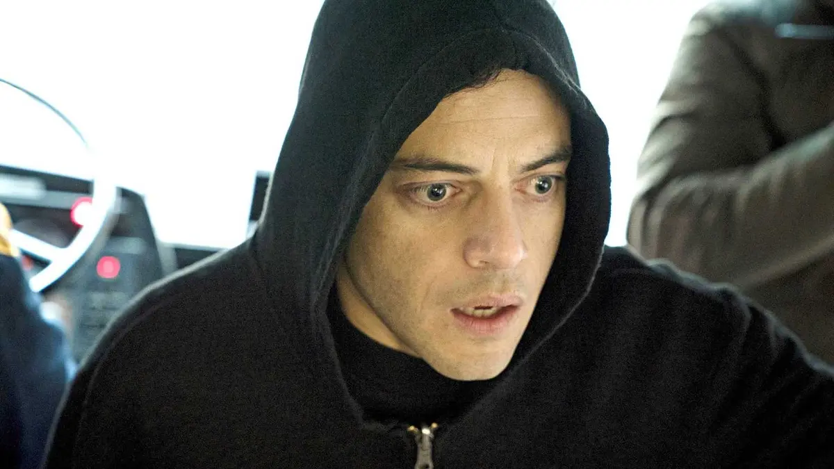 Elliot Alderson (Rami Malek) wearing a black hoodie and looking shocked in Mr. Robot season 4, episode 5