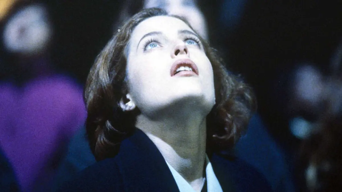 Gillian Anderson looks up as Scully in The X-Files