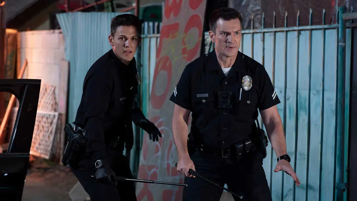 Still of Nathan Fillion John Nolan and David Gridley as Connor Craig in The Rookie season 7.