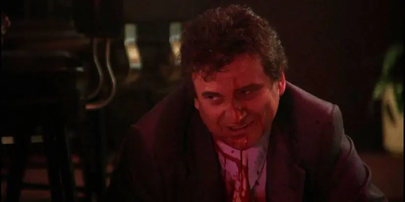Goodfellas Tommy DeVito with blood on his shirt looking remorseful