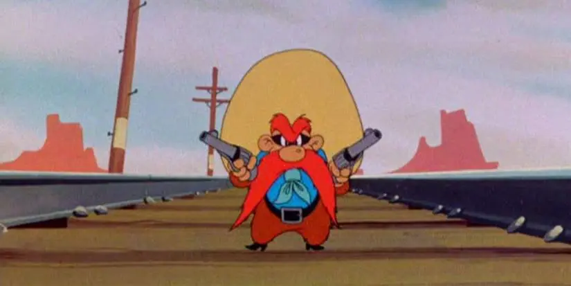 Yosemite Sam standing on train tracks pointing two revolvers at Bugs Bunny in 1945's Hare Trigger
