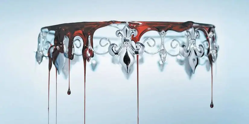 Red Queen's book cover shows an upside down crown with blood