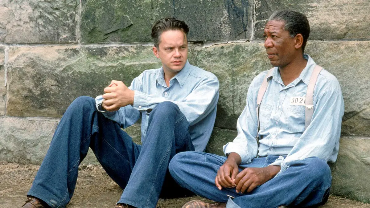 Andy (Tim Robbins) and Red (Morgan Freeman) talking by the prison walls in The Shawshank Redemption